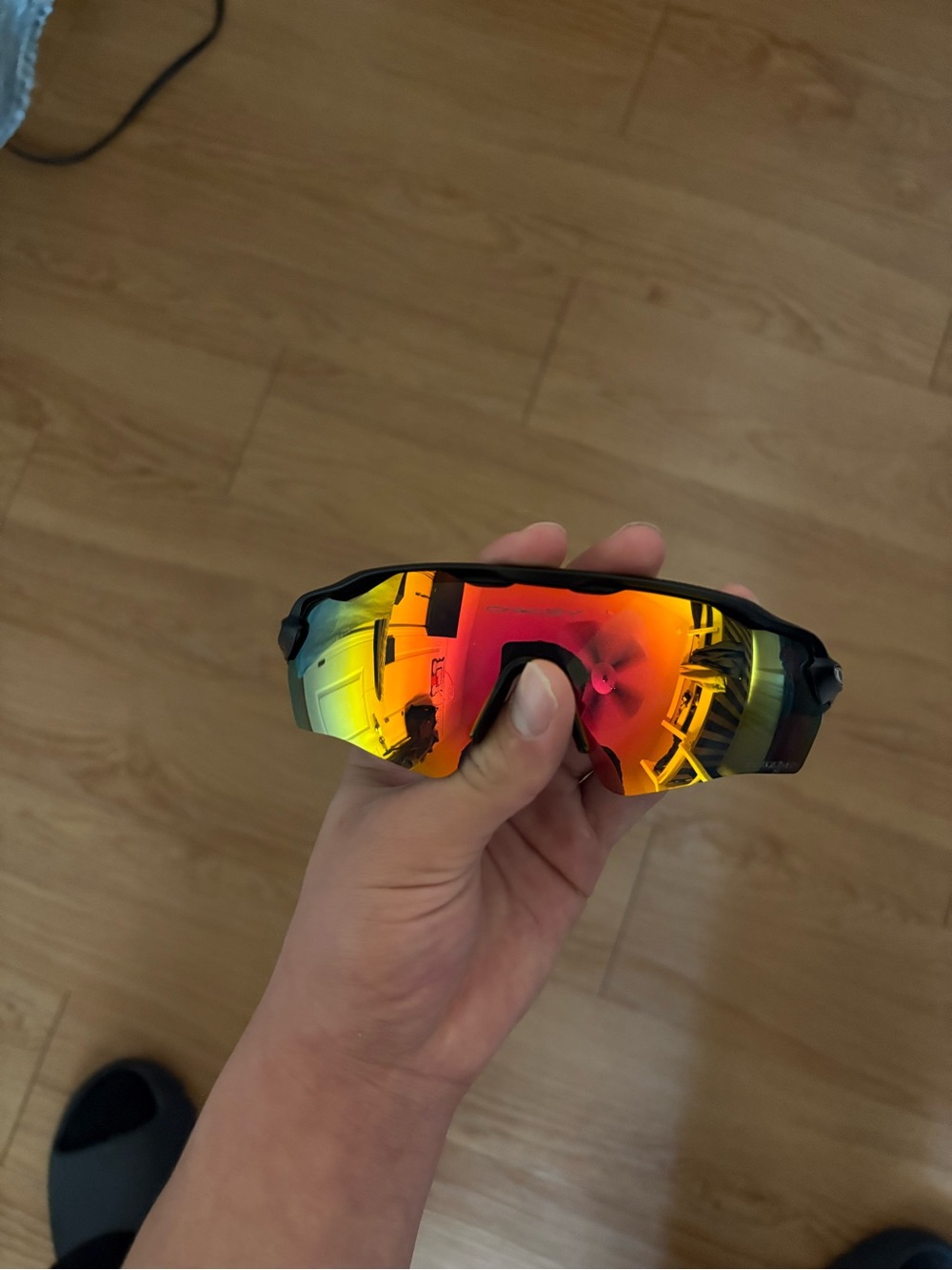 Oakley Sunglasses - Black Frame with Red-Orange Mirrored Lens